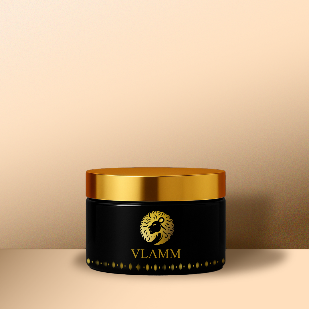 Black jar with gold lid featuring the VLAMM logo on a beige background